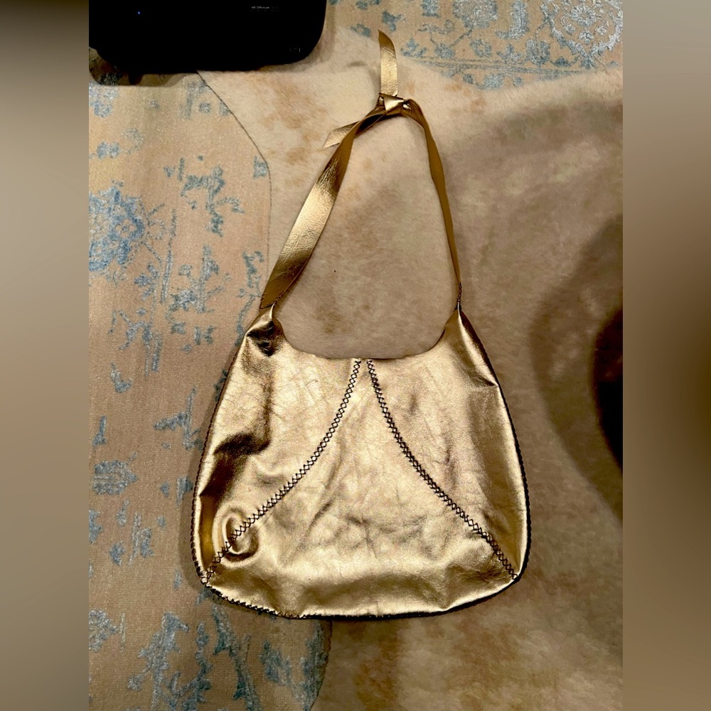 Designer gold voltaatelier bag. Made in Brazil.